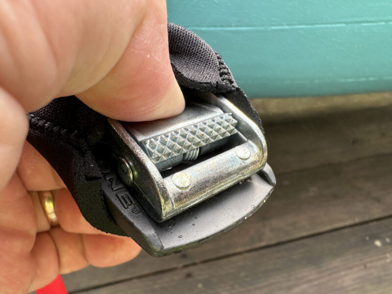 Galvanized buckle on Malone Auto Racks’ load strap.
