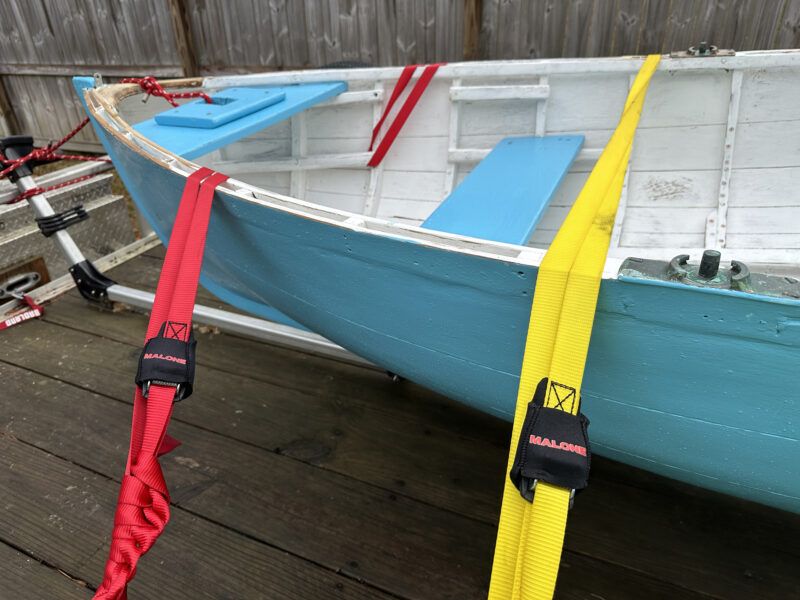 Boat secured with Malone straps of varied lengths.