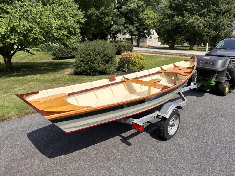 A finished 14' Heidi skiff on a trailer