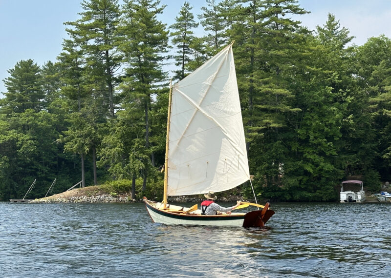A 14' Heidi skiff with spritsail.