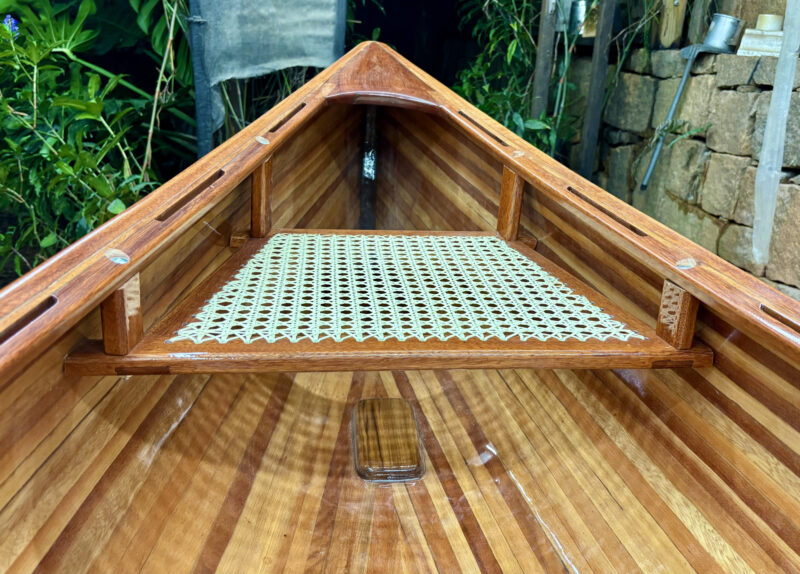 Cane seat in stern of Puddle Duck canoe.