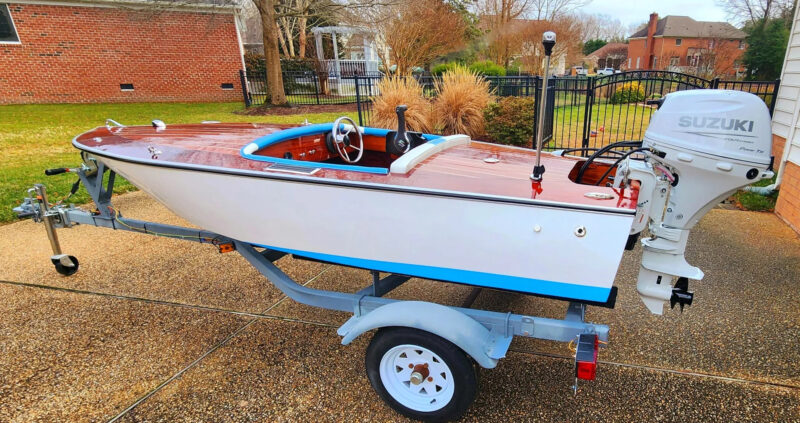 Glen-L Squirt with Suzuki outboard on a trailer.