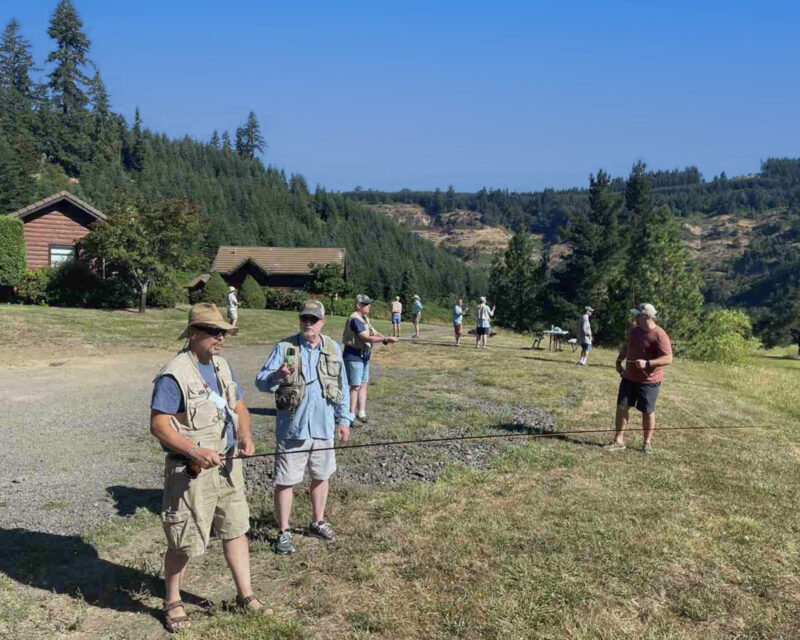 Reel Recovery participants getting fly-casting tips.