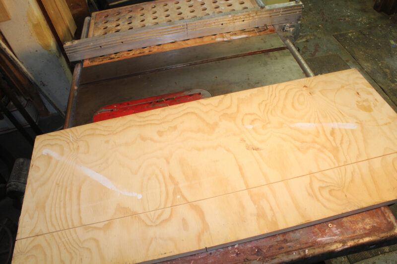 Plywood base with a shallow kerf cut into it.