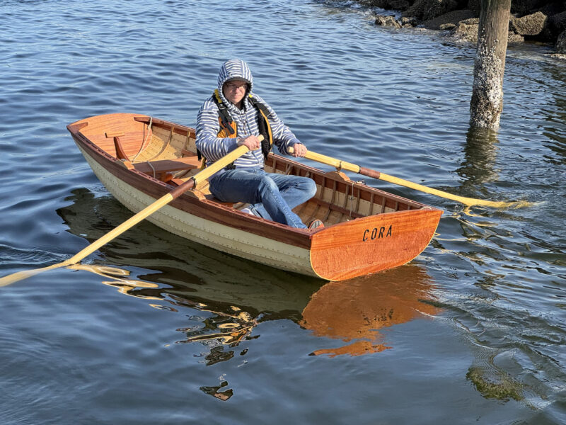 Stern view of Norwegian Pram Dulcibella under oar