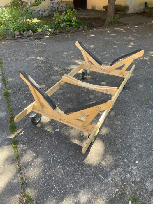 V-shaped boat stand with padded arms.