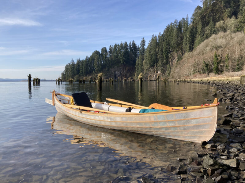 St Lawrence Skiff on rocky shore of Columbia River.