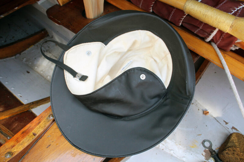 Upturned black sou’wester with flannel lining.
