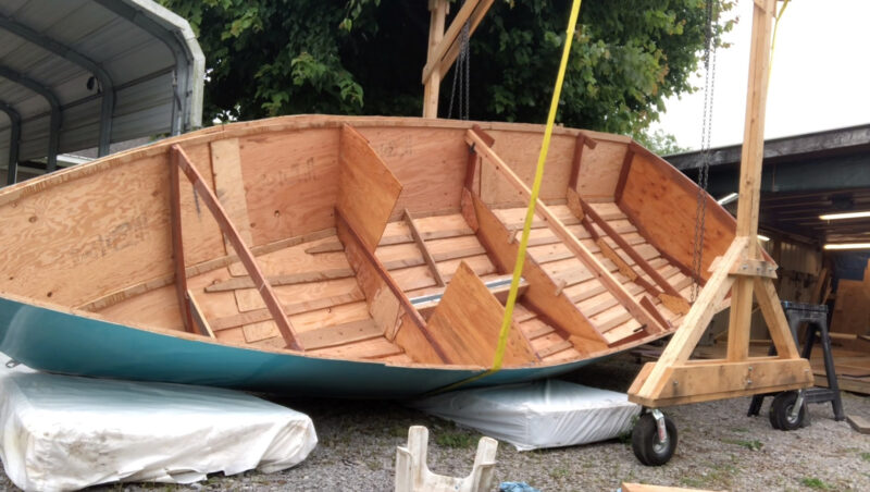 Part-built plywood stitch-and-glue Glen-L 19 being turned over.