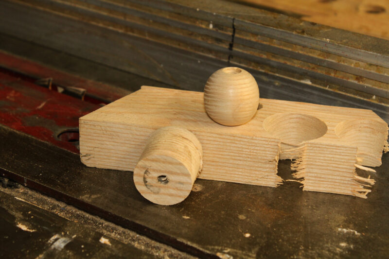 Shaping a cylindrical plug into a spherical parrel bead.
