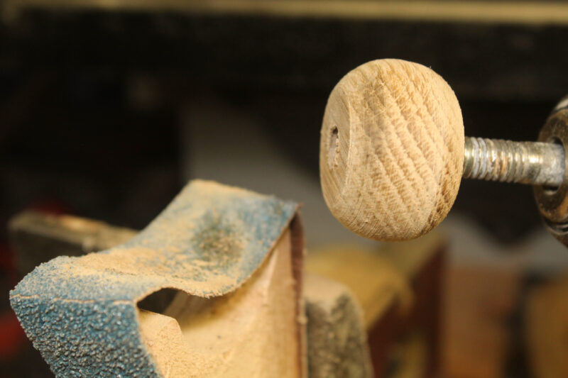 A parrel bead part formed from a wooden plug.