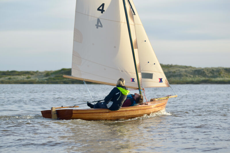Two young people sailing Windsong Nº4.