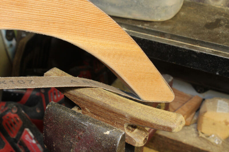 Using a sanding bow to shape a horn cleat.