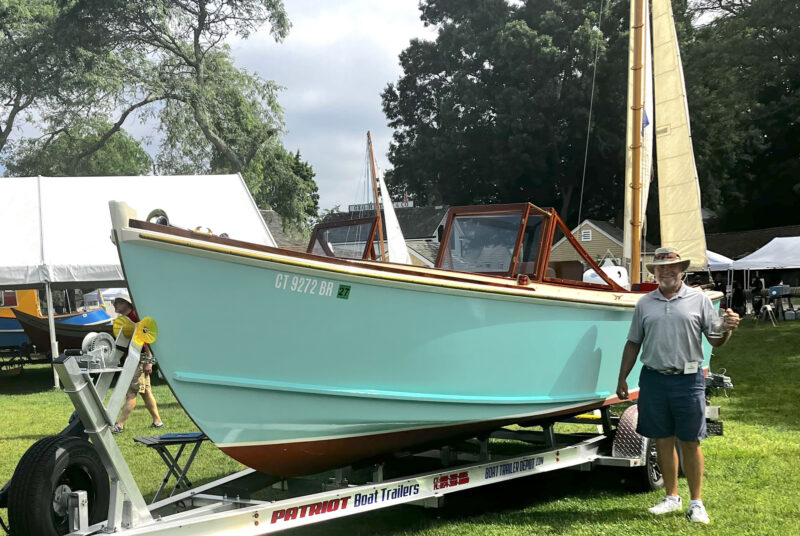 Award-winning teal-colored runabout at the 2026 WoodenBoat Show.